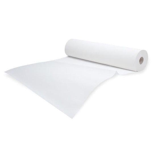 Um rolo de papel crepom branco Meditrade Rollicel® para uso médico, ligeiramente desenrolado sobre um fundo branco simples. O rolo está posicionado na diagonal, com a extremidade ligeiramente curvada para o lado.