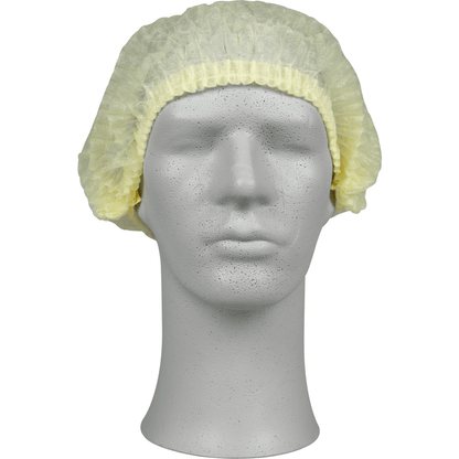 Em uma cabeça de manequim cinza está uma touca amarela clara, PP da Abena Re-Seller GmbH, que oferece proteção higiênica para a área médica ou gastronômica. A touca descartável cobre a parte superior e as laterais da cabeça.