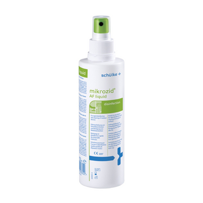 Um frasco de spray branco com a inscrição "Schülke Mikrozid® AF liquid" para desinfecção com texto verde-azulado e um bico de pulverização verde. Símbolos e texto indicam o uso médico.