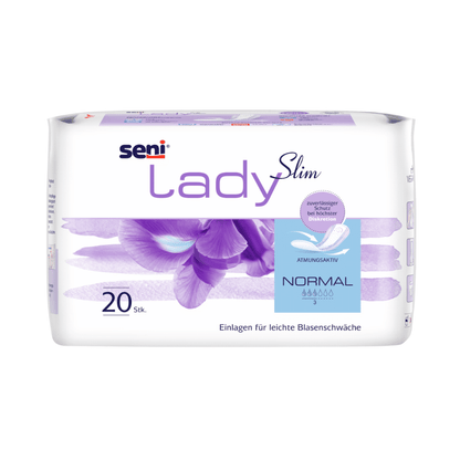 Uma embalagem de 20 unidades de Seni Lady Slim Normal Einlagen da TZMO Deutschland GmbH apresenta-se em uma embalagem branco-violeta com motivo floral, detalhes do produto em alemão e bloqueio de odor para fraqueza leve da bexiga.