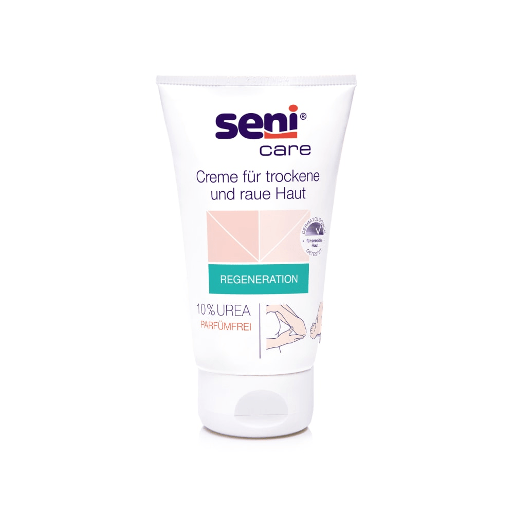 Um tubo de 100 ml de creme Seni Care da TZMO Deutschland GmbH para pele seca e áspera tem um fundo branco com acentos rosa claro e verdes. O rótulo indica 10% de ureia, é sem perfume, aumenta o teor de umidade e contém instruções em alemão.