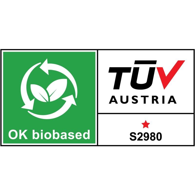 O dispensador de mesa Scotch™ Karim Rashid da 3M Deutschland GmbH possui um rótulo de certificação com uma área verde com símbolo de reciclagem e folhas com a inscrição "OK biobased" e uma área branca com "TÜV AUSTRIA", uma estrela vermelha e "S2980".