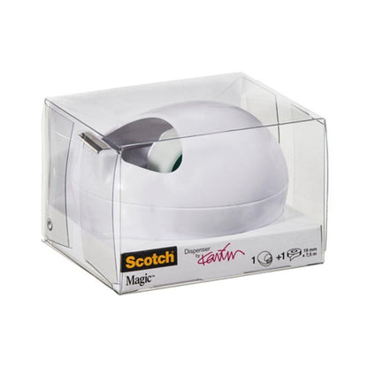 Um dispensador de mesa Scotch™ Karim Rashid da 3M Deutschland GmbH está em uma embalagem de plástico transparente com dispensador branco e uma etiqueta na frente, com detalhes da marca e do produto em letras pretas e amarelas.