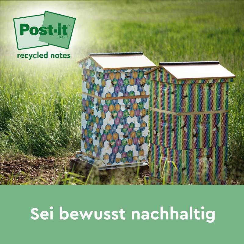 Duas colmeias coloridas estão na grama ao sol. No canto superior esquerdo aparece um logotipo verde de Post-it® Recycling Notes (38 mm x 51 mm, 100 folhas/bloco, 100% PEFC) da 3M Deutschland GmbH. Abaixo está o texto: "Seja conscientemente sustentável.