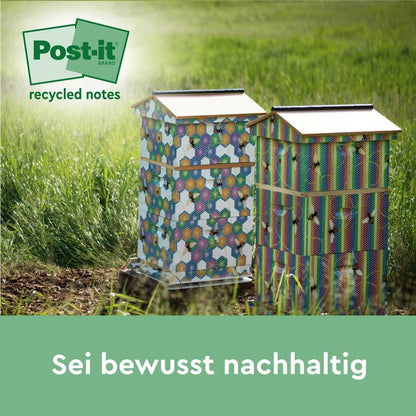 Duas colmeias coloridas estão na grama ao sol. No canto superior esquerdo aparece um logotipo verde de Post-it® Recycling Notes (38 mm x 51 mm, 100 folhas/bloco, 100% PEFC) da 3M Deutschland GmbH. Abaixo está o texto: "Seja conscientemente sustentável.